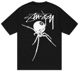 Détail graphique araignée sur t-shirt streetwear