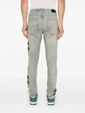 Jean Amiri Ma Quad Applique Skinny Jeans Blue au style denim premium chez Sneaker6ix Dakar