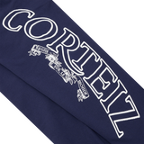 Détail de la finition à bas ouvert du Corteiz Superior Royale Open Hem Pant Navy