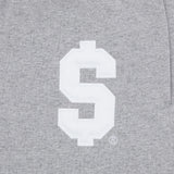 Détail du logo Supreme appliqué sur le sweatpant gris